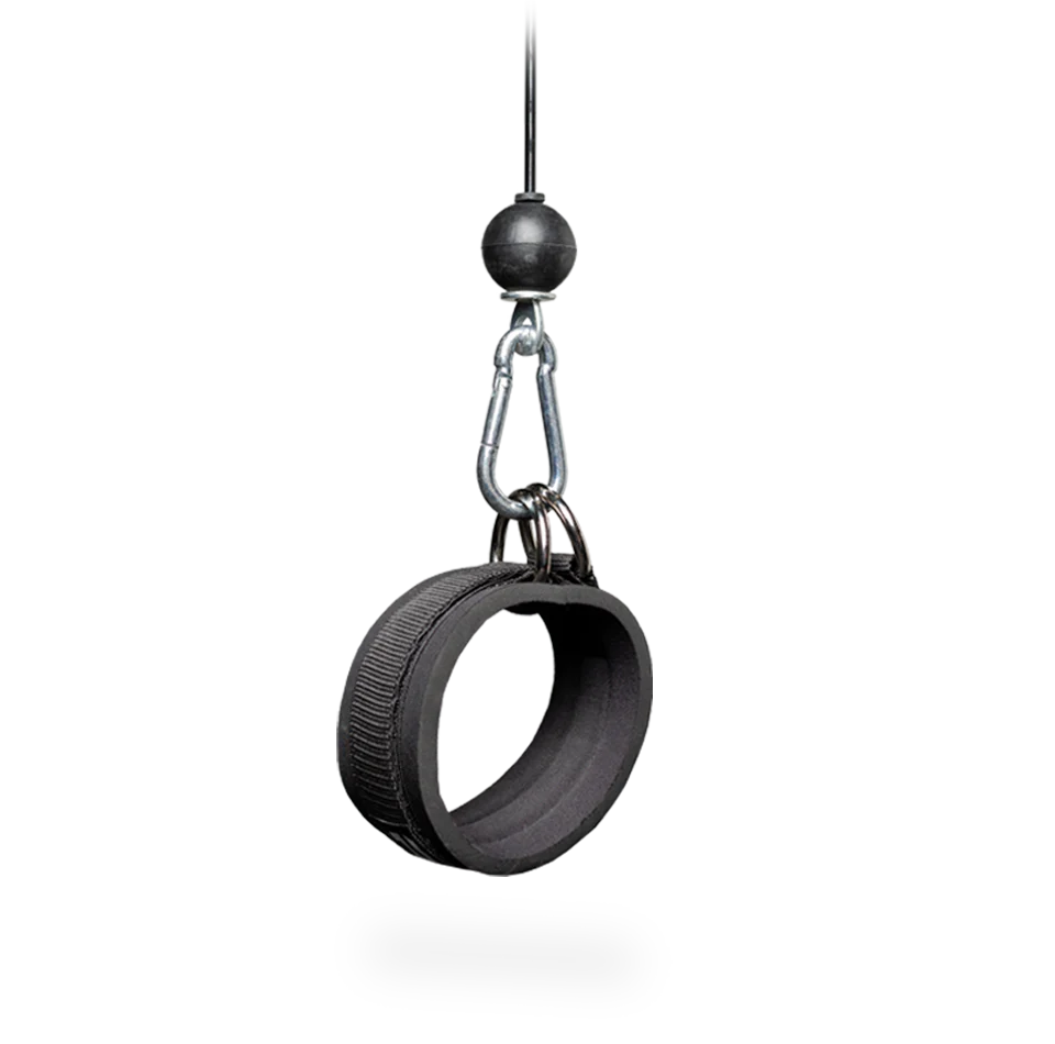 Black tire swing hanging from a hook on a white background