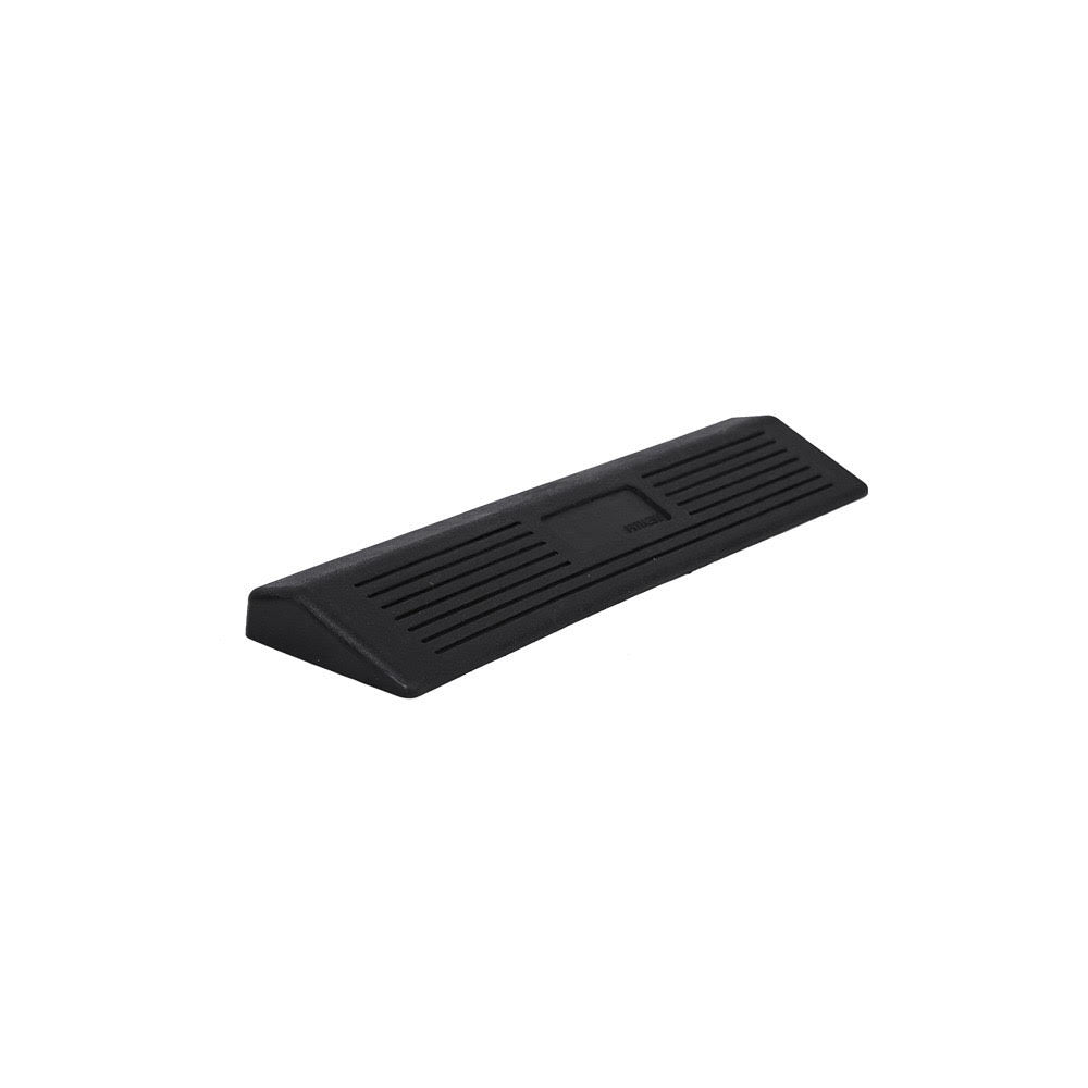 Black rubber door stopper on a white background