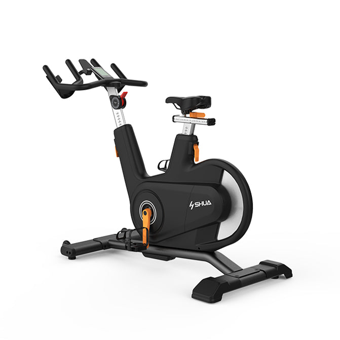 Black and orange exercise bike with 'Shua' branding on a white background