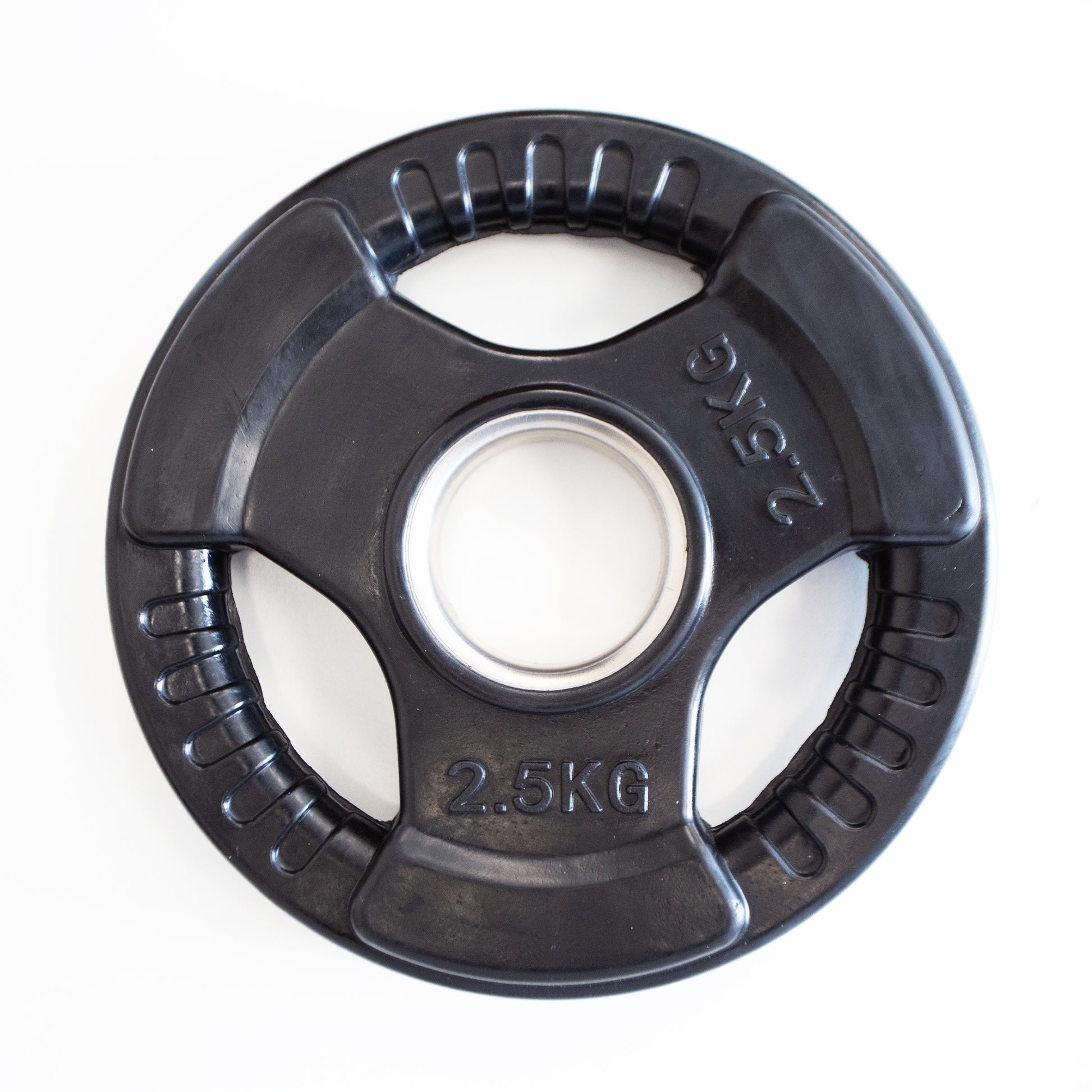 Black weight plate with '2.5KG' marking on a white background