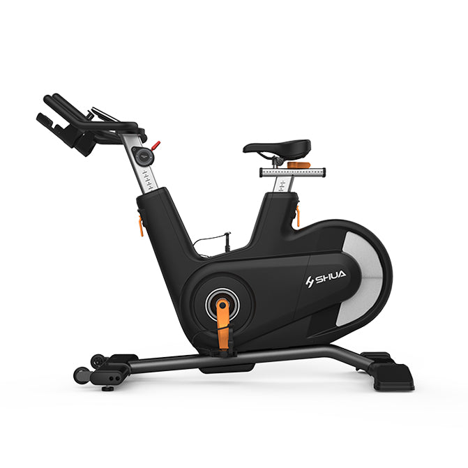 Black exercise bike with orange accents on a white background