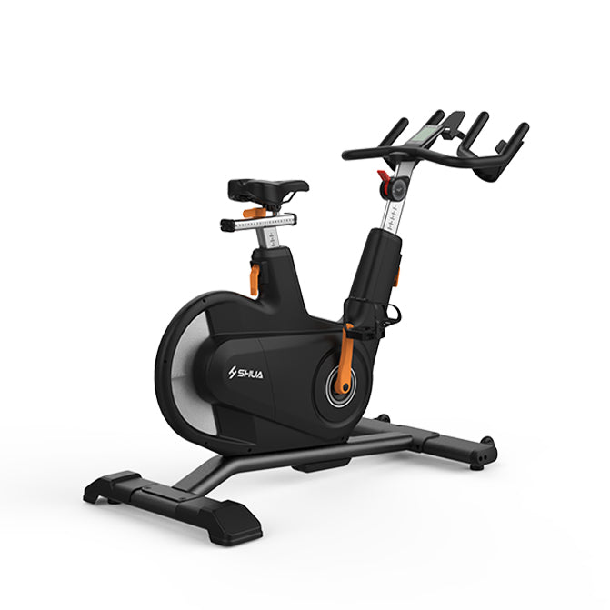 Black and orange exercise bike on a white background