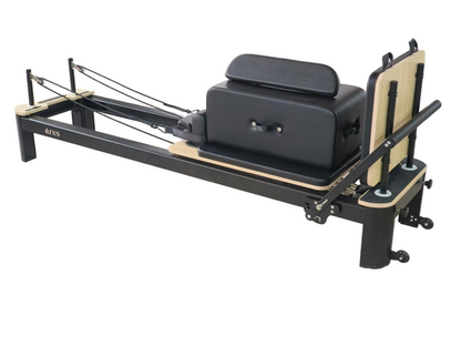 Pilates reformer machine on a white background