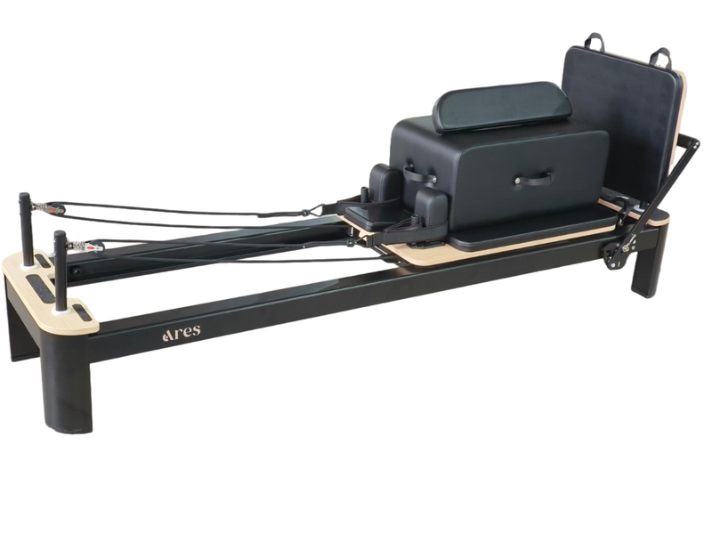 Pilates reformer machine with 'ares' branding on a white background