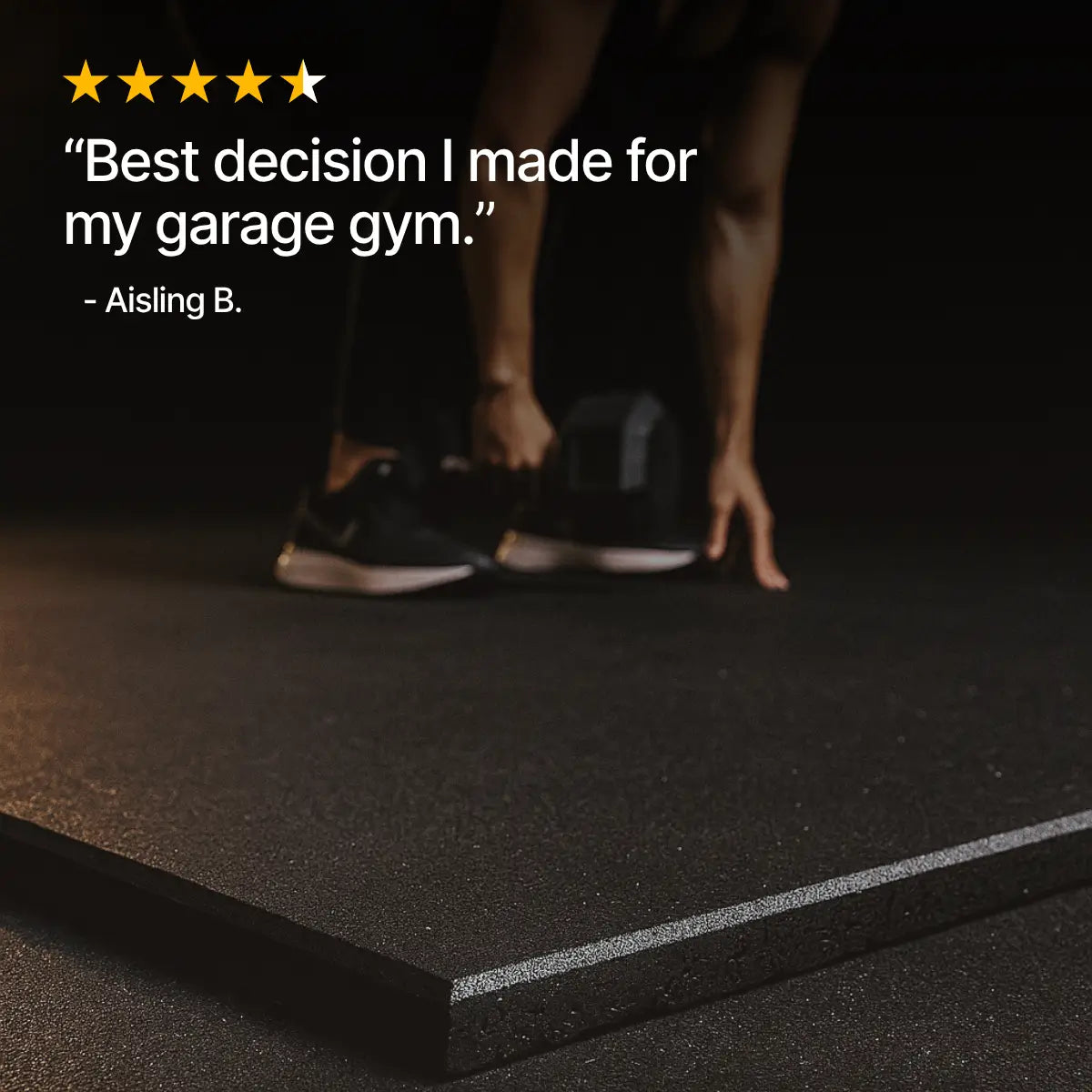 Person standing on a black mat with text about a garage gym decision.