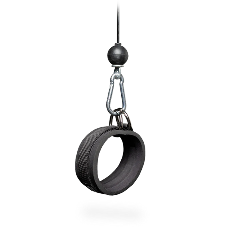 Black tire swing hanging from a hook on a white background