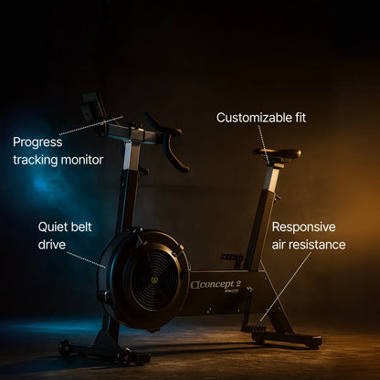 Exercise bike with features highlighted on a dark background