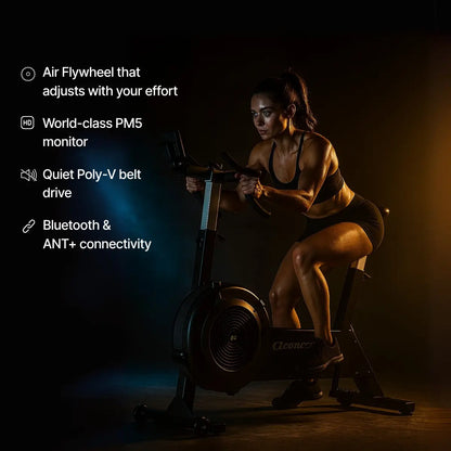 Woman exercising on a stationary bike with product features listed on the left.