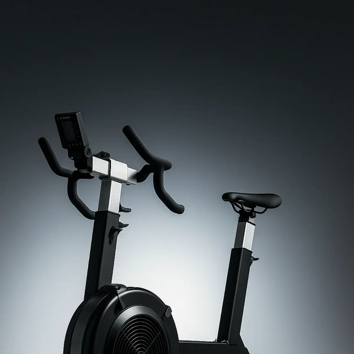 Black exercise bike on a gradient gray background