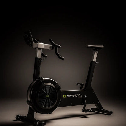 Black exercise bike with Concept2 logo on a dark background