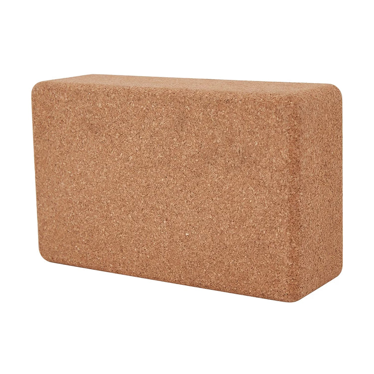 Cork yoga block on a white background