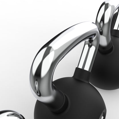 Close-up of a black kettle with chrome handle on a white background