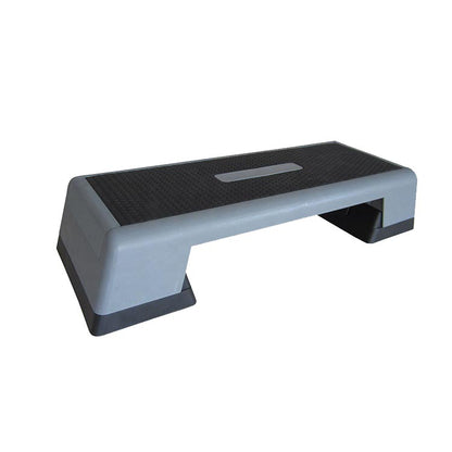 Adjustable aerobic step with rubber grip platform, predominantly gray in color.
