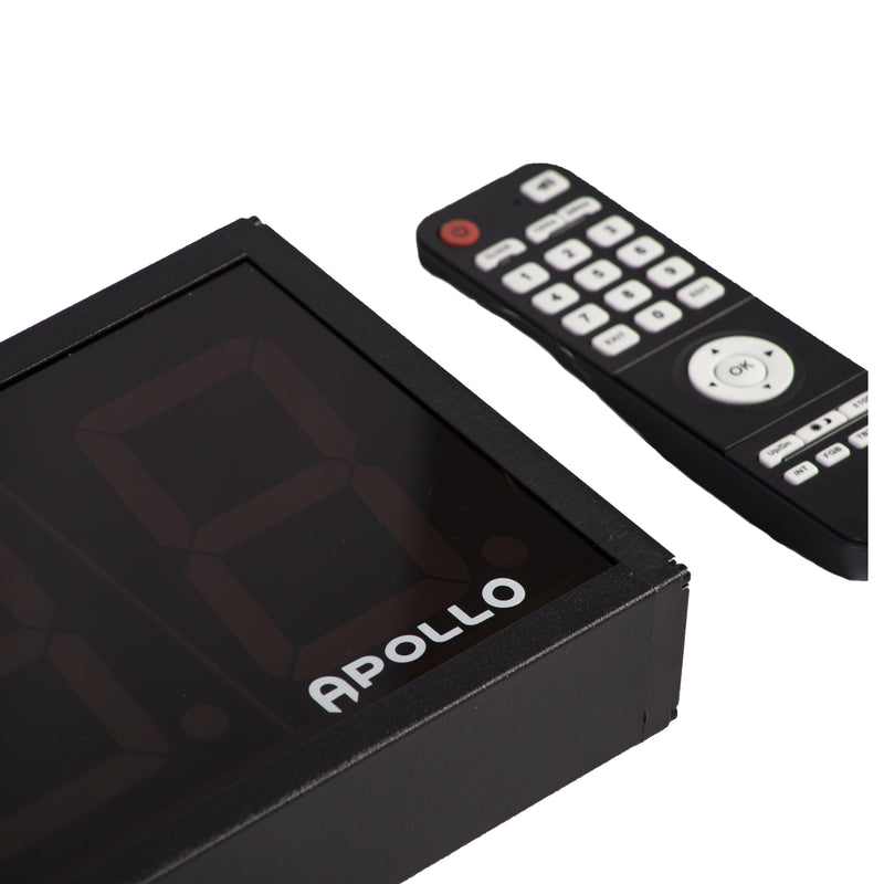 A digital gym timer with a black screen displaying the brand name 'Apollo', alongside a black remote control with buttons.